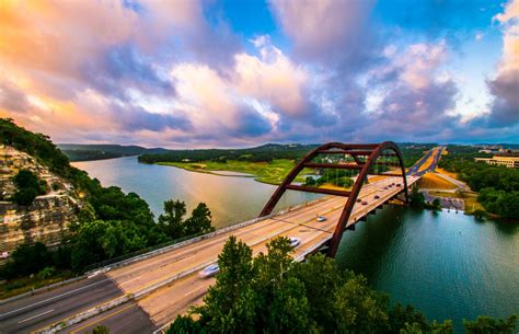 Dramatic Colorful Clouds At Golden Hour Pennybacker Bridge At Sunrise