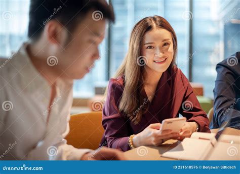 Asian Colleagues Discussing In Meeting Room Stock Photo Image Of