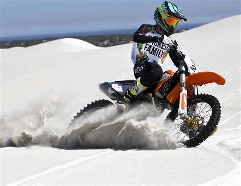 Black mountain provides a network of dirt trails up, over. Dirt bike riding in the African sand dunes - Wicked Family
