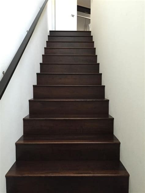 On the landing area, a stair nose is used along with the hardwood flooring to form a square platform for changing directions. Engineered Oak Stained Wood Stairs 7 1/2 in. | Wood floor installation, Apartment hallways, Wood ...