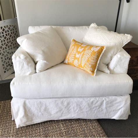 Blue pillow on white bed with wooden headboard in bedroom interior with armchair. Carly Armchair & Reviews | Joss & Main | Furniture, Bed ...