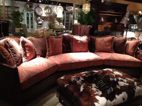 A Very Large Sectional With Fabric On The Front And Top Grain Leather