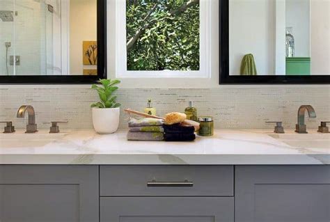 The mixture of clear, iridescent, brown, yellow, shades of green glass tile will give a luminescent quality to any bathroom wall. Top 70 Best Bathroom Backsplash Ideas - Sink Wall Designs