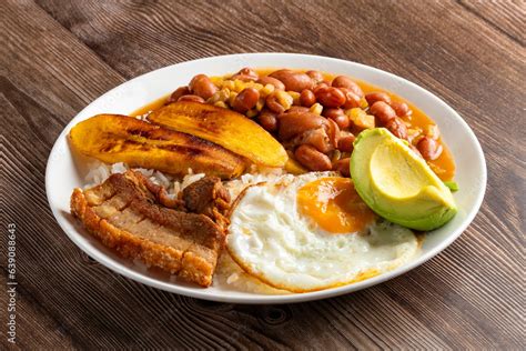 Bandeja Paisa Typical Dish At The Antioqueña Region Of Colombia It Consists Of Chicharrón