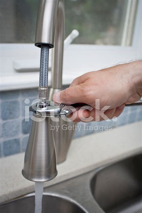 This repair is focused around a ball style faucet. Fixing The Kitchen Faucet Stock Photos - FreeImages.com
