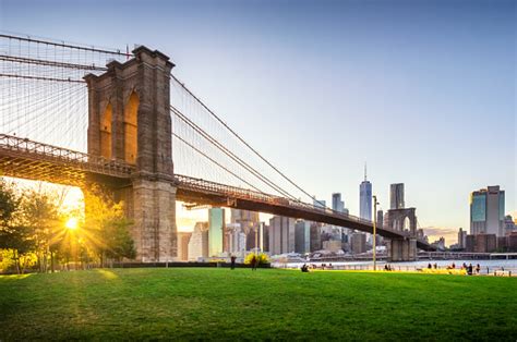 The cult, sorry religion had been busy buying up properties around brooklyn heights since they set up their world headquarters there in 1909, although they've recently. Brooklyn Bridge And Manhattan At Sunset Nyc Stock Photo ...