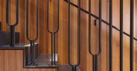 This Black Metal Stair Railing Makes A Strong Statement With Its U