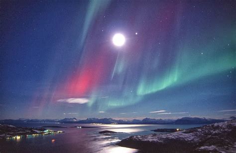Northern Lights During Full Moon Over The Arctic Coast Of Norway