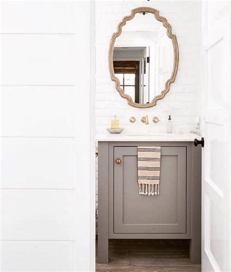 The Instagram Page Shows An Image Of A Bathroom With Gray Vanity And