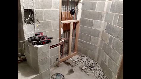 The process of installing a drain from a tub to shower conversion, transition from 1 1/2'' to a 2'' drain is shown in a worse scenario than you'll probably e. How to do shower drain in the basement Part #1 - YouTube