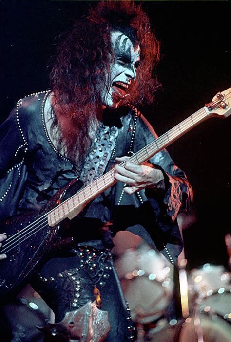 Gene simmons has recorded 1 hot 100 song. Gene Simmons Of Kiss Performing Photograph by Michael Ochs ...
