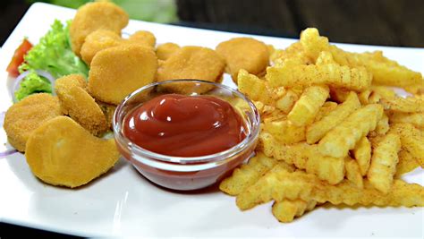 Chicken Nuggets With French Fries On A Plate Not Loopable Video Stock