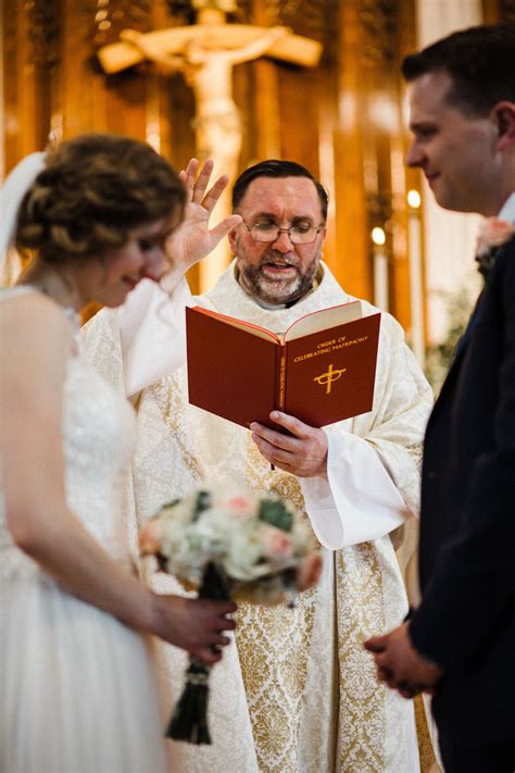 Catholic Wedding Mass Priest Blessing Bride And Groom Wedding