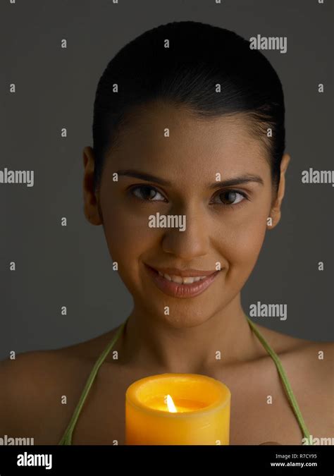 Woman Holding A Candle Stock Photo Alamy