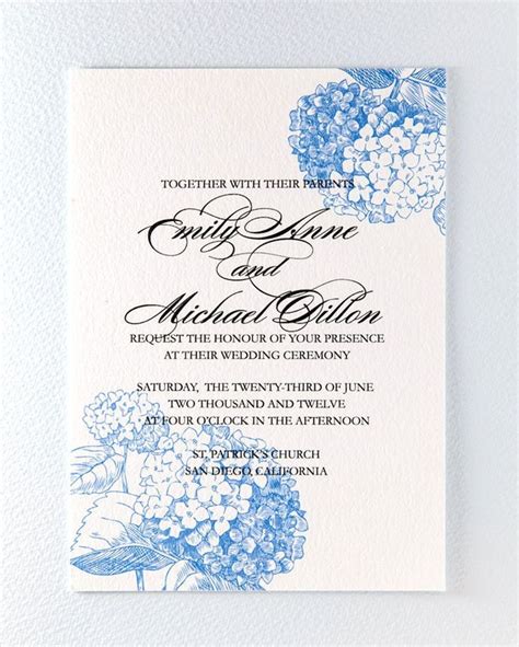 A Blue And White Wedding Card With Hydrangeas On The Front In Black Ink