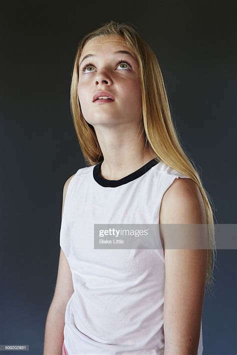Blond Teenage Girl Looking Up High Res Stock Photo Getty Images