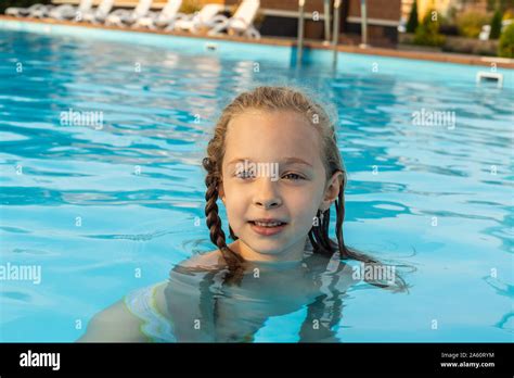 Portrait Of A Girl Swimming In Swimming Pool Stock Photo Alamy
