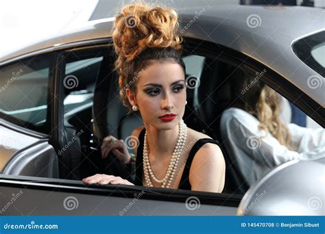 Beautiful Fashion Model Posing In A Sports Car Editorial Stock Photo