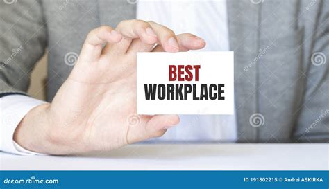 Businessman Holding A Card With Text Best Workplace Business Concept