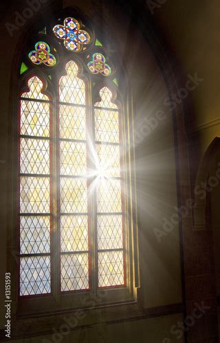 Church Stained Glass Window With Light Shining Through Buy This Stock