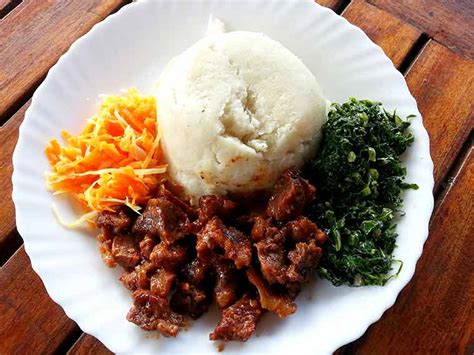 To eat ugali, form a small ball with hands. Culture | Bigumbrella