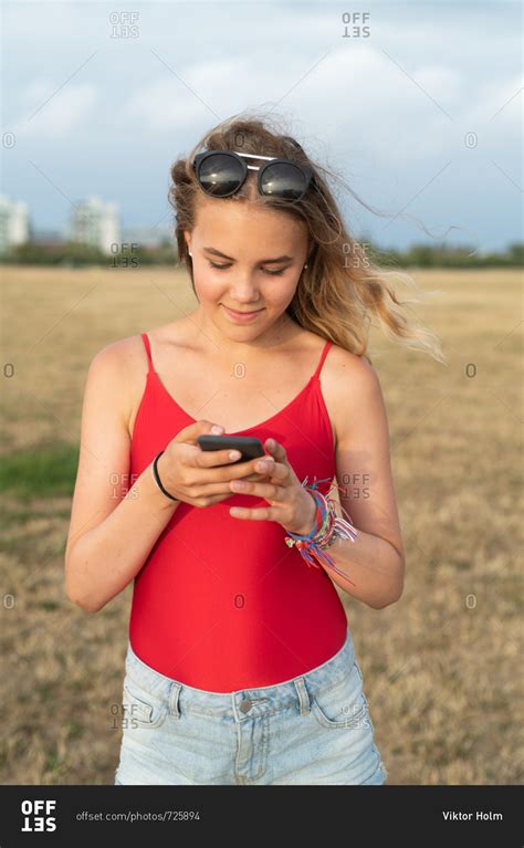 Blonde Teenage Girl Using Cell Phone Stock Photo Offset