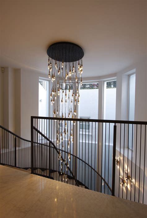 Pendant light over stair ideas & photos. Double storey structural glass windows leading to ...