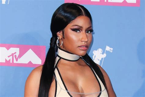 Nicki Minaj Models Head To Toe Burberry Plaid Outfit With Sock Boots