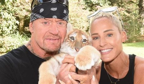 Undertaker And His Wife Michelle Mccool Undertaker Wwe Undertaker