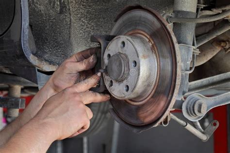 Car Mechanic Working On Disc Brakes Stock Image Image Of Servicing