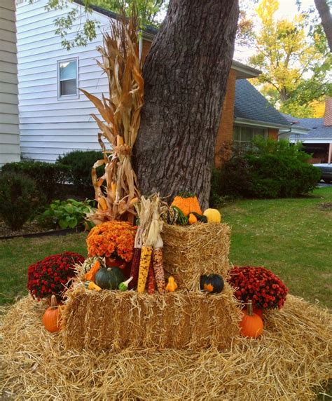 Come see how our outdoor fall decor turned out this year and get inspired to make your own hay bale decorations. Fall decor, corn stalk, Indian corn, pumpkins, gourds ...