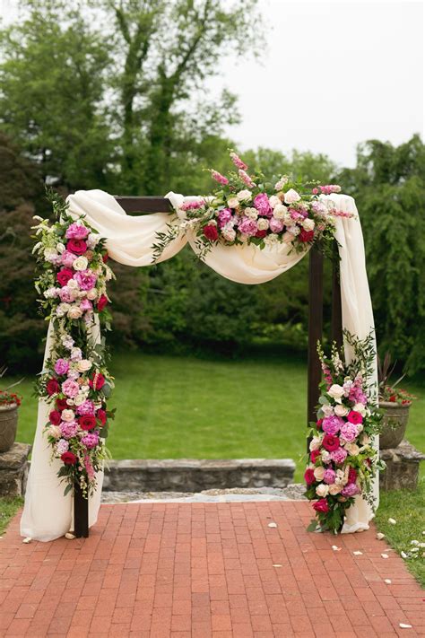 Wedding Arch With Lush Pink Flowers And Draping By Lark Floral At