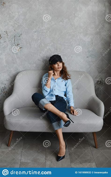 High Fashioned Model Girl Wearing High Heel Shoes Hat Blue Shirt And
