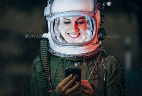 Beautiful Female Astronaut With Mobile Phone Stock Photo By Addictive