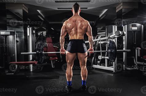 Muscular Man Lifting Some Heavy Barbells 1217014 Stock Photo At Vecteezy