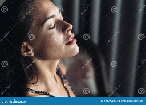 Side View Of Portrait Of Sensual Brunette Girl With Closed Eyes And Natural Make Up Stock Image