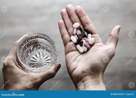 Glass Of Water And Pills In Woman Hands Drug Addiction Stock Image