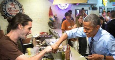 president obama fist bumped a bbq restaurant cashier who told a funny gay joke e news