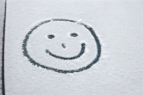 Premium Photo Close Up Of Smiley Face On Snow