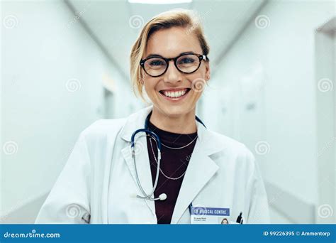 Female Doctor Standing In Hospital Corridor Stock Image Image Of