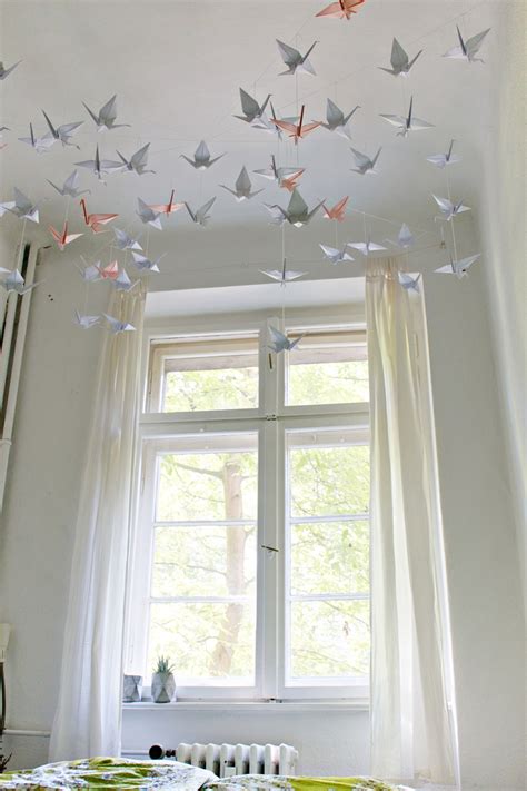Ceiling decoration ideas diy ideas to add interest to your ceiling stained plywood slat ceiling. DIY | Renters-Friendly Origami Ceiling Decoration