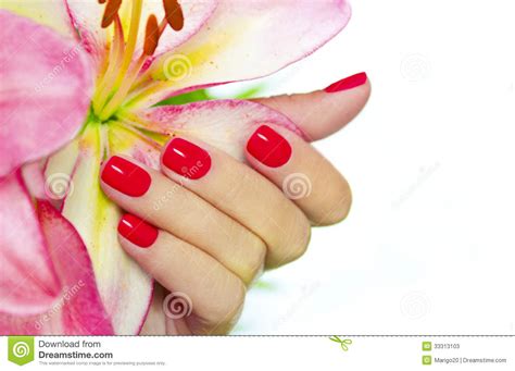 manicure salon concept beautiful women hands with golden nail manicure on a white background