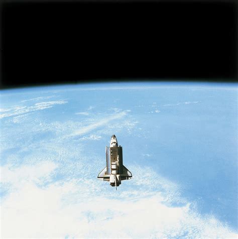 Aerial View Of The Space Shuttle In Orbit Above Earth Photograph By