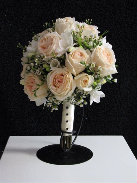 Peach Garden Roses Freesia And Delicate Wax Flowers In A Posy Bouquet