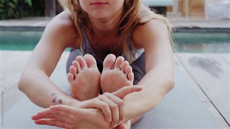 Woman Exercising With Yoga Barefoot By Stocksy Contributor Jovo