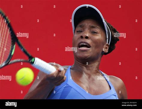 Venus Williams Of The United States Hits A Return Shot Against Jelena