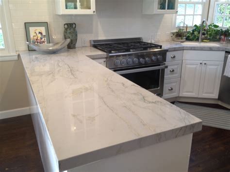 A white countertop with subtle gray veining, a glossy finish, and a simple eased edge makes a crisp contrast. White Princess Granite Price Per Square Foot - Madison Art Center Design