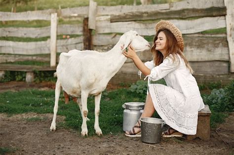 Free Photo Girl Farmer With White Goat Woman And Small Goat Green Grass Eco Farm Farm And