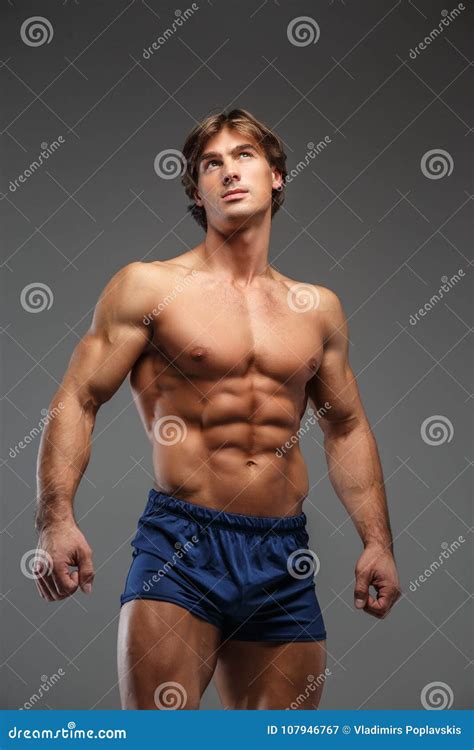 Awesome Shirtless Bodybuilder In Blue Shorts Royalty Free Stock