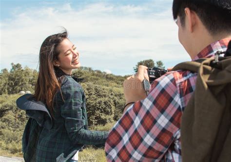 A Man Taking Photos For His Asian Girlfriend While Traveling To Mountains Stock Image Image Of